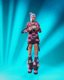 a woman in a pink and black striped sweater is standing on a blue background holding a gun .