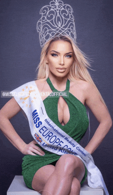 a woman in a green dress is holding a sash that says miss europe