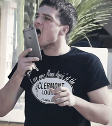 a man wearing a t-shirt that says clermont lounge