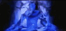 a blurry picture of a person sitting in a lotus position in a dark room .