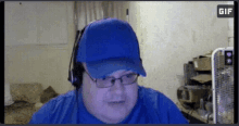 a man wearing a blue hat and headphones is looking at the camera with a gif icon in the corner