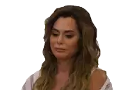 a woman with long hair and a white shirt is looking at the camera
