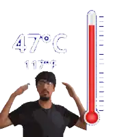 a man stands in front of a thermometer reading 47 degrees celsius
