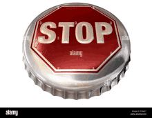 a bottle cap with a stop sign on it on a white background