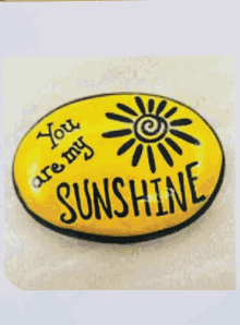 a yellow sign that says you are my sunshine on it