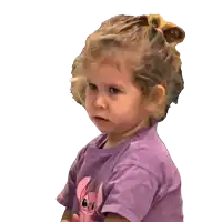 a little girl wearing a purple shirt with a pink bow