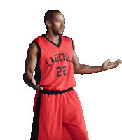 a basketball player wearing a red ladevils jersey