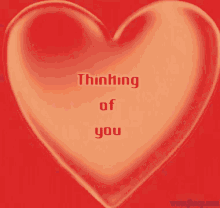 a red heart with the words " thinking of you " written on it