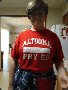 a person wearing a red shirt that says altoona phy ed