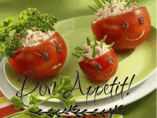 a plate of food with tomatoes decorated to look like faces and the words `` bon appetit '' .