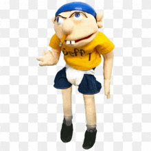 a puppet wearing a yellow shirt that says squad 1