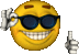 a smiley face wearing sunglasses is giving a thumbs up sign .