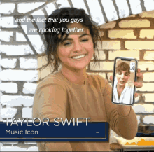 a woman holding up a cell phone with taylor swift music icon