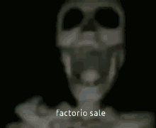 a blurry picture of a skeleton with the words factorio sale written on the bottom