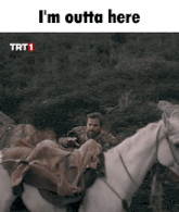 a man riding a horse with the words i 'm outta here