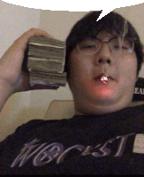 a man wearing glasses holds a stack of money in his hand