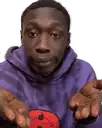 a man wearing a purple hoodie is holding a red ball in his hands .