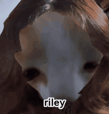 a close up of a person 's face with the name riley on it