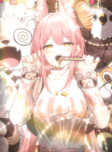 a girl with pink hair is holding a candy in her mouth and wearing a shirt that says ' u.i. '