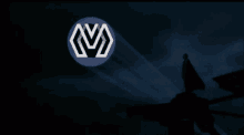 a man in a cape is standing in front of a logo that says mv