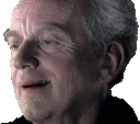 a close up of an elderly man 's face with gray hair and a black shirt .