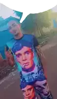 a man wearing a shirt that has a picture of a man smoking a cigarette