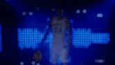 a kentucky basketball player is standing in front of a blue background