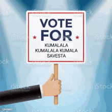 a hand is holding a sign that says `` vote for kumalala kumalala kumalala savesta '' .