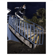 a skateboarder is doing a trick on the railing of a set of stairs