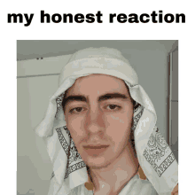 a picture of a man with a bandana on his head and the words " my honest reaction " above him