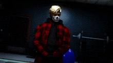 a man wearing a red plaid shirt and skull mask