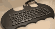 a black keyboard that looks like a bat wing