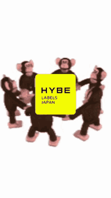 a group of stuffed monkeys are in a circle with a yellow box that says hybe labels japan