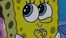 a close up of a cartoon character named spongebob with big eyes