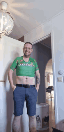 a man wearing a green joker crop top