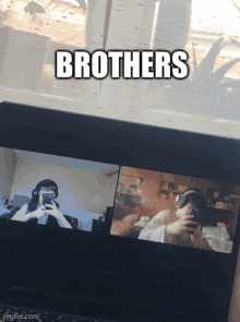 a laptop with a picture of two people and the word brothers on top