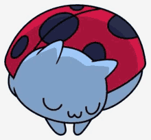 a blue cat is sleeping in a ladybug costume .