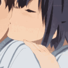 a boy and a girl are kissing each other in a cartoon .