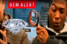 a man is looking through a magnifying glass at a diamond under a sign that says gem alert