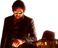 a man wearing sunglasses and a black jacket is standing next to a barrel