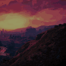 a sunset over a city and mountains with a bird flying in the distance