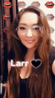 a woman wearing glasses has the name larr written on her chest