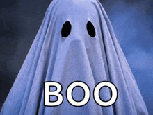 a ghost is covered in a blue sheet and the word boo is above it