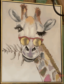 a painting of a giraffe wearing sunglasses and holding a branch in its mouth