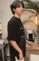 a man wearing a black t-shirt that says " japan "