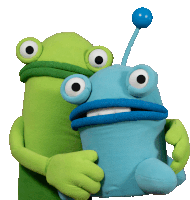 two green and blue stuffed animals are hugging