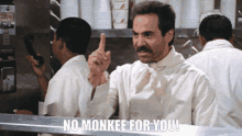 a man says no monkee for you in a restaurant kitchen