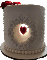 a white cake with a heart in the middle of it