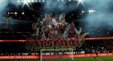a soccer stadium with a banner that says the arsenal