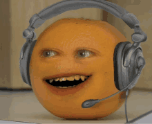 an orange wearing a pair of headphones with a microphone